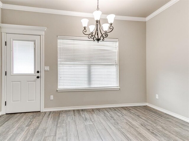 8344 NW 137th St, Oklahoma City, OK 73142 - unfurnished dining area featuring a chandelier, light wood-type flooring, crown molding, baseboards, and healthy amount of natural light