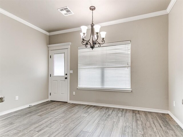 8344 NW 137th St, Oklahoma City, OK 73142 - unfurnished dining area with a chandelier, wood finished floors, ornamental molding, and baseboards