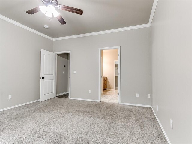 8344 NW 137th St, Oklahoma City, OK 73142 - unfurnished bedroom with ornamental molding, carpet floors, baseboards, ensuite bathroom, and ceiling fan