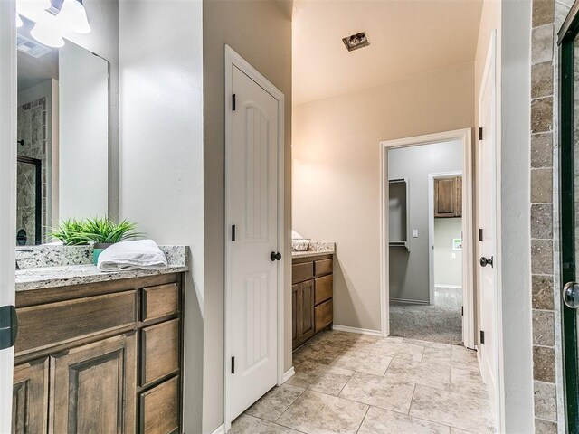 8344 NW 137th St, Oklahoma City, OK 73142 - bathroom with vanity and baseboards