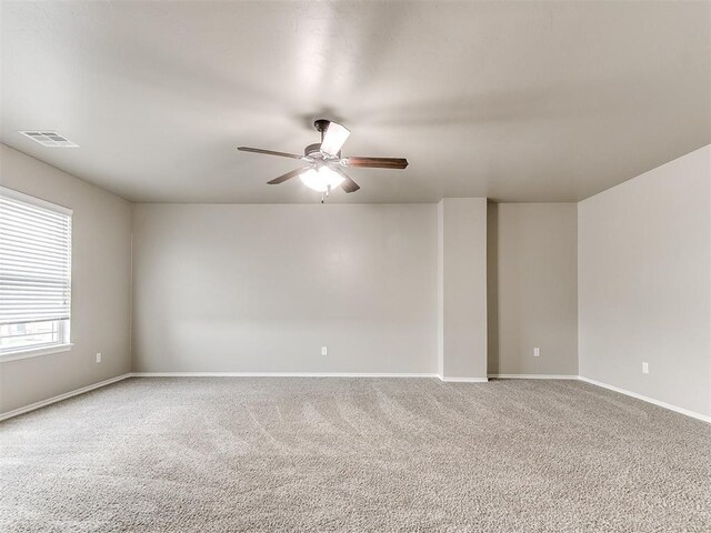 8344 NW 137th St, Oklahoma City, OK 73142 - carpeted spare room with ceiling fan and baseboards