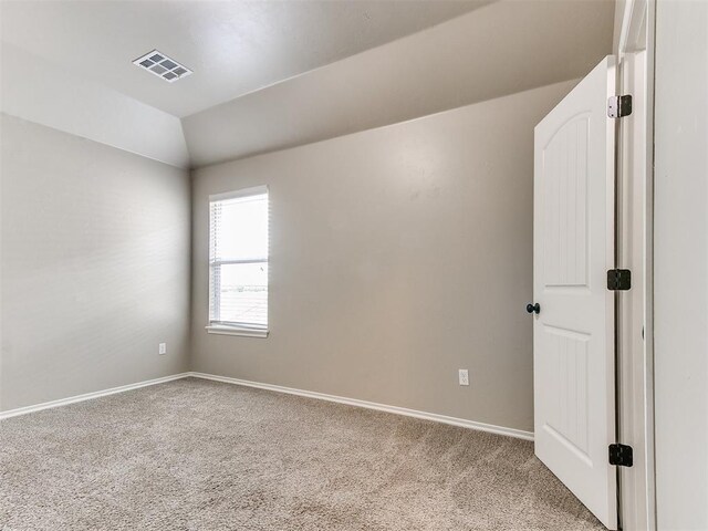 8344 NW 137th St, Oklahoma City, OK 73142 - empty room with carpet flooring, baseboards, and lofted ceiling