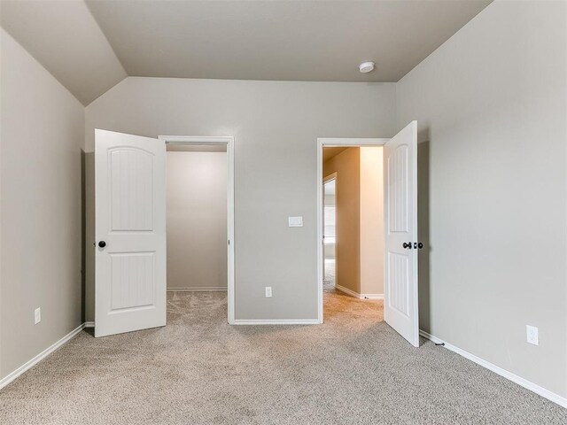 8344 NW 137th St, Oklahoma City, OK 73142 - unfurnished bedroom with carpet, baseboards, and vaulted ceiling