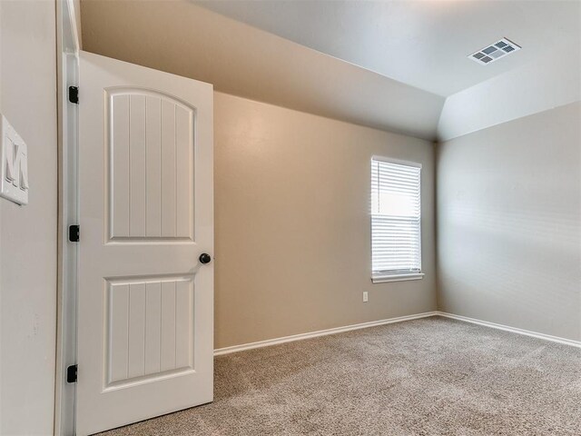 8344 NW 137th St, Oklahoma City, OK 73142 - unfurnished bedroom with carpet flooring, baseboards, and lofted ceiling