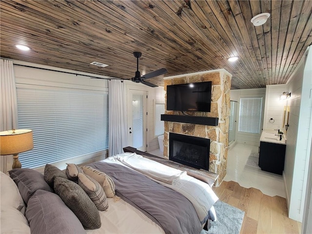 72 Green Persimmon Trl, Broken Bow, OK 74728 - bedroom with a fireplace, wood finished floors, and wooden ceiling