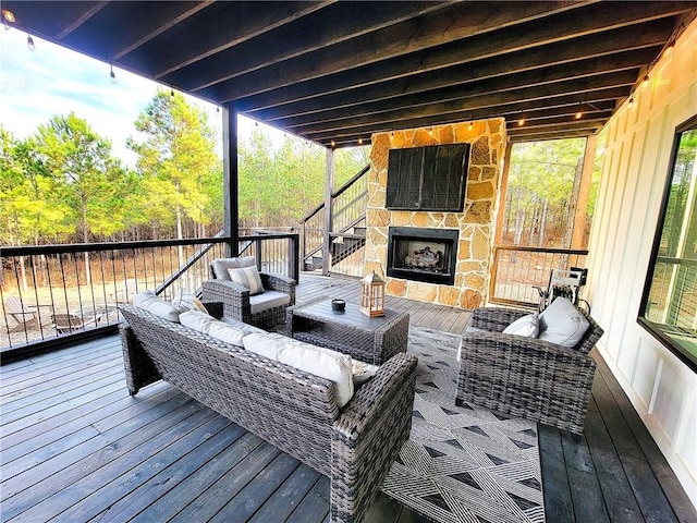 72 Green Persimmon Trl, Broken Bow, OK 74728 - deck with an outdoor living space with a fireplace