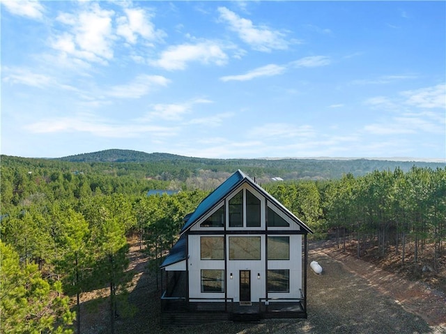 72 Green Persimmon Trl, Broken Bow, OK 74728 - back of property with a forest view