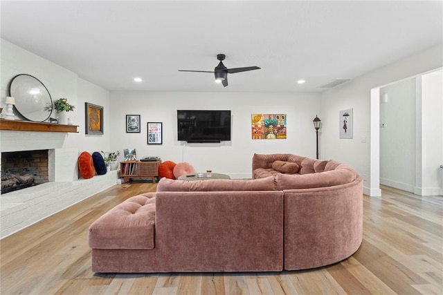 1206 N Kaiser Rd, Weatherford, OK 73096 - living room with a fireplace, wood finished floors, recessed lighting, a ceiling fan, and baseboards