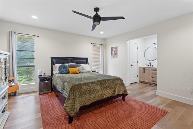 1206 N Kaiser Rd, Weatherford, OK 73096 - bedroom featuring light wood finished floors, baseboards, recessed lighting, connected bathroom, and a ceiling fan
