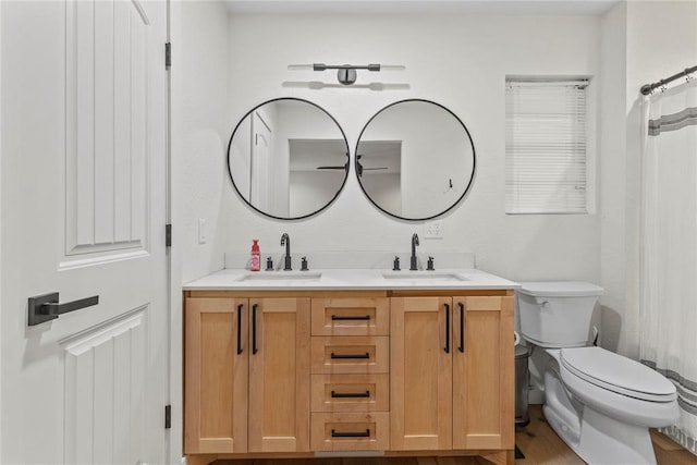 1206 N Kaiser Rd, Weatherford, OK 73096 - bathroom featuring double vanity, toilet, and curtained shower