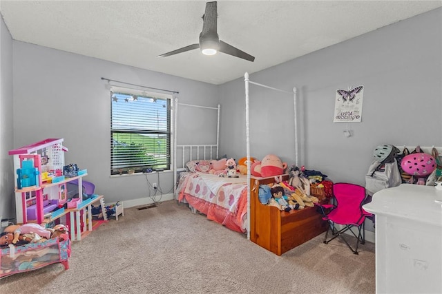 1206 N Kaiser Rd, Weatherford, OK 73096 - carpeted bedroom featuring a ceiling fan, baseboards, and a textured ceiling