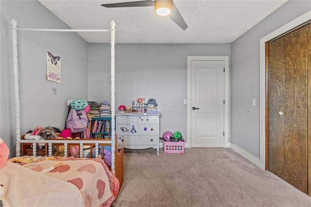 1206 N Kaiser Rd, Weatherford, OK 73096 - carpeted bedroom with a textured ceiling and ceiling fan