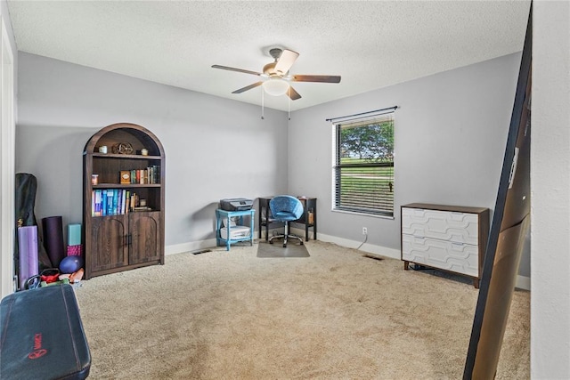1206 N Kaiser Rd, Weatherford, OK 73096 - carpeted office space featuring ceiling fan, a textured ceiling, and baseboards
