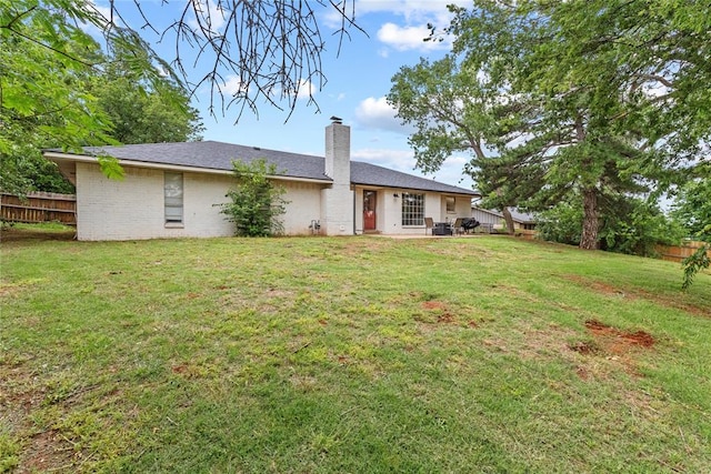 1206 N Kaiser Rd, Weatherford, OK 73096 - rear view of house featuring a chimney