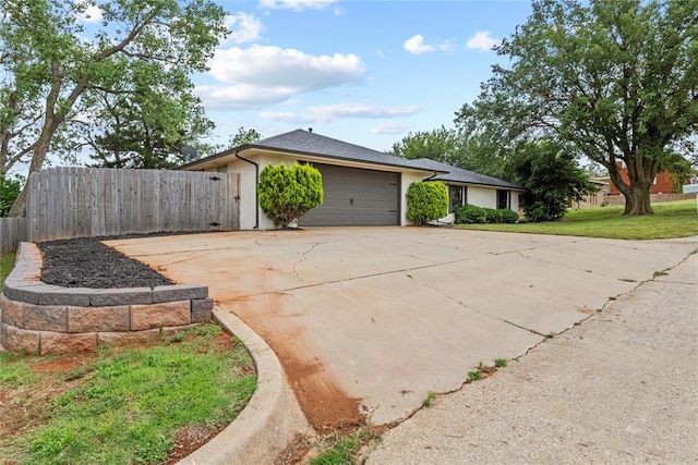1206 N Kaiser Rd, Weatherford, OK 73096 - view of side of home featuring a garage and driveway