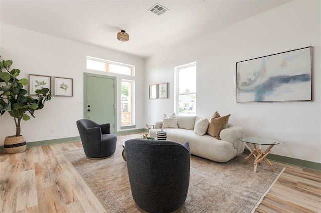 1619 NE 9th St, Oklahoma City, OK 73106 - living room featuring light wood finished floors and baseboards