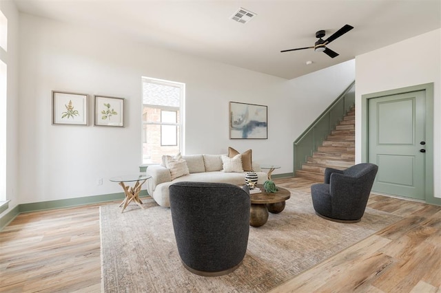 1619 NE 9th St, Oklahoma City, OK 73106 - living area featuring stairs, light wood-type flooring, baseboards, and a ceiling fan