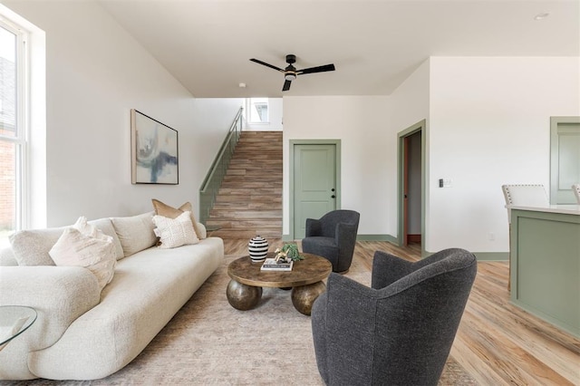 1619 NE 9th St, Oklahoma City, OK 73106 - living room with a ceiling fan, light wood finished floors, and stairway