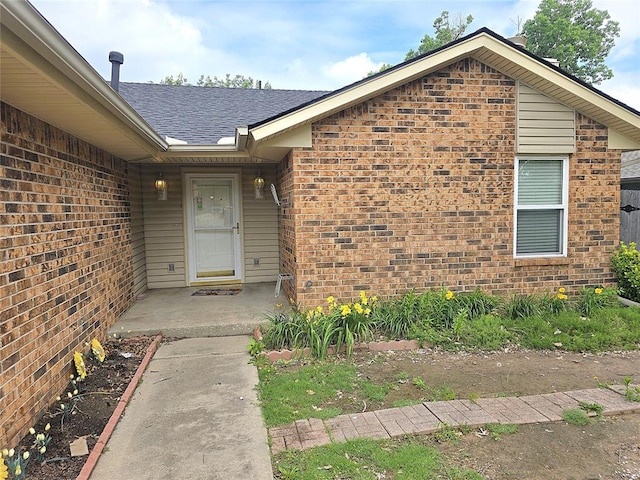 3512 Tiffany Dr, Moore, OK 73160 - property entrance featuring brick siding and roof with shingles