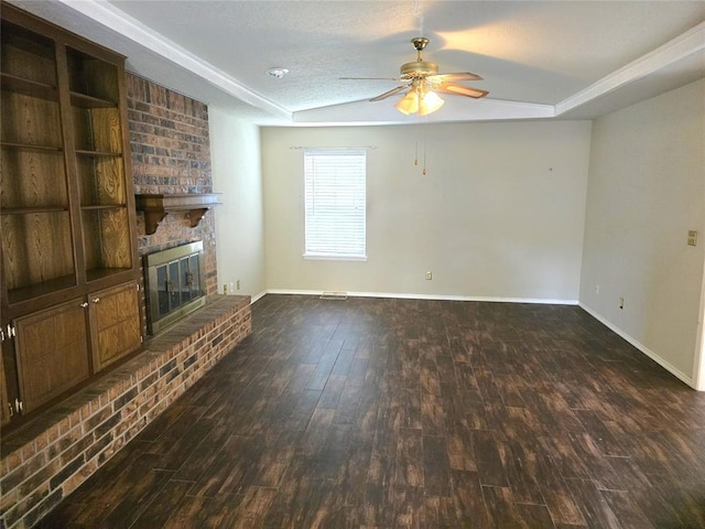 3512 Tiffany Dr, Moore, OK 73160 - unfurnished living room with ceiling fan, wood finished floors, a fireplace, and a raised ceiling