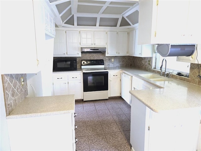 3512 Tiffany Dr, Moore, OK 73160 - kitchen with range with electric cooktop, under cabinet range hood, black microwave, white dishwasher, and backsplash