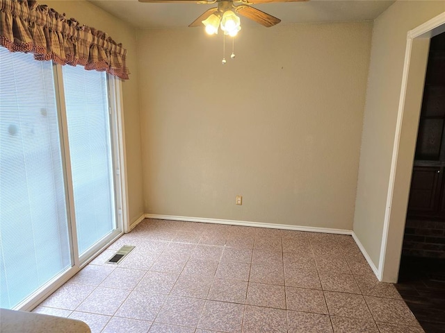 3512 Tiffany Dr, Moore, OK 73160 - empty room featuring a ceiling fan and light tile patterned floors