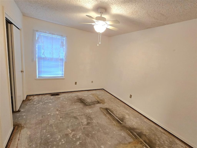 3512 Tiffany Dr, Moore, OK 73160 - unfurnished bedroom featuring a textured ceiling, a closet, and ceiling fan