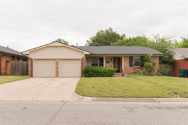 3901 NW 56th Pl, Oklahoma City, OK 73112 - single story home featuring an attached garage, brick siding, and concrete driveway
