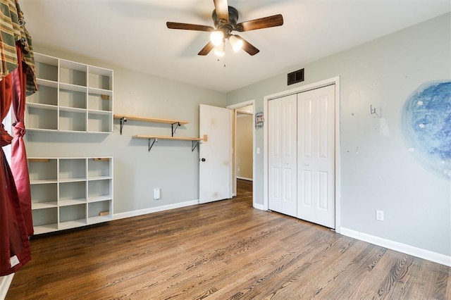 3901 NW 56th Pl, Oklahoma City, OK 73112 - unfurnished bedroom featuring wood finished floors, baseboards, a closet, and a ceiling fan