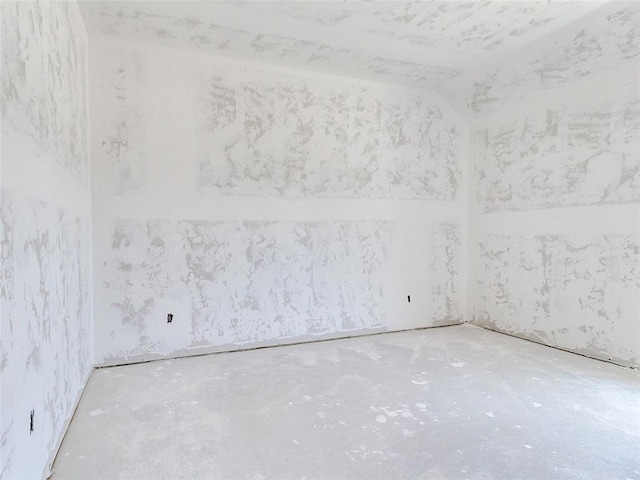 11701 Ward Rd, Edmond, OK 73034 - unfurnished room featuring lofted ceiling and concrete floors
