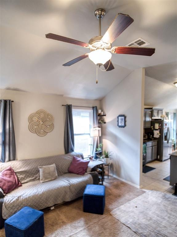 12825 William Penn Blvd, Oklahoma City, OK 73120 - living area with lofted ceiling, a ceiling fan, light carpet, and baseboards