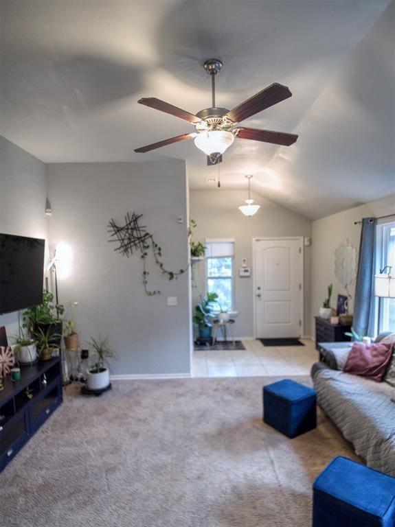 12825 William Penn Blvd, Oklahoma City, OK 73120 - carpeted living area featuring lofted ceiling, ceiling fan, and baseboards