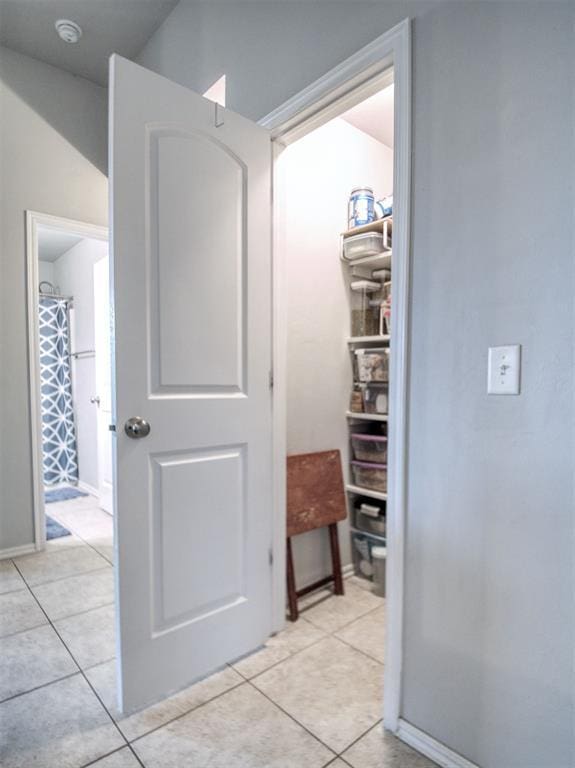 12825 William Penn Blvd, Oklahoma City, OK 73120 - hallway with light tile patterned flooring and baseboards