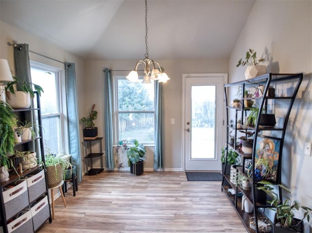 12825 William Penn Blvd, Oklahoma City, OK 73120 - entryway with lofted ceiling, a chandelier, plenty of natural light, light wood-style flooring, and baseboards