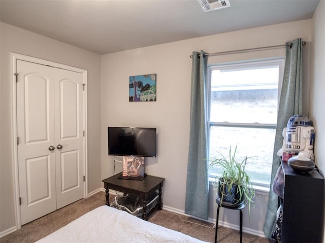 12825 William Penn Blvd, Oklahoma City, OK 73120 - carpeted bedroom with baseboards and a closet