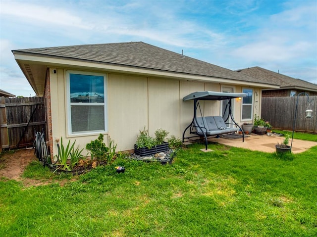12825 William Penn Blvd, Oklahoma City, OK 73120 - rear view of house featuring a patio area and roof with shingles