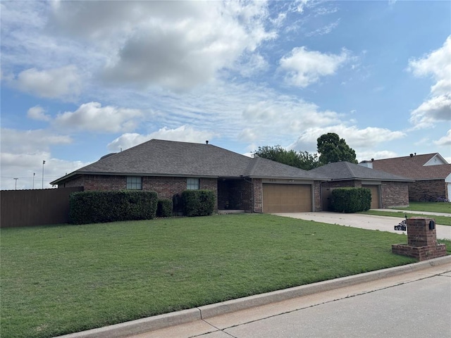 425 W Crooked Branch Way, Mustang, OK 73064 - view of front of home with a garage, concrete driveway, brick siding, and a shingled roof