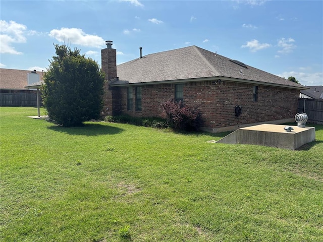 425 W Crooked Branch Way, Mustang, OK 73064 - rear view of house featuring brick siding, a chimney, and a shingled roof