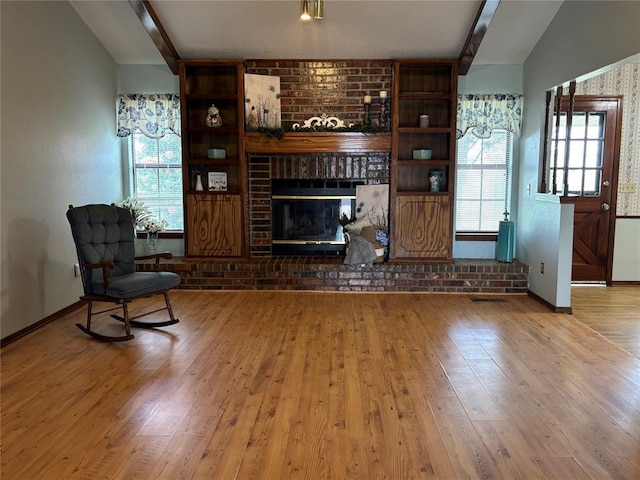 425 W Crooked Branch Way, Mustang, OK 73064 - living area featuring wood finished floors, a brick fireplace, and vaulted ceiling