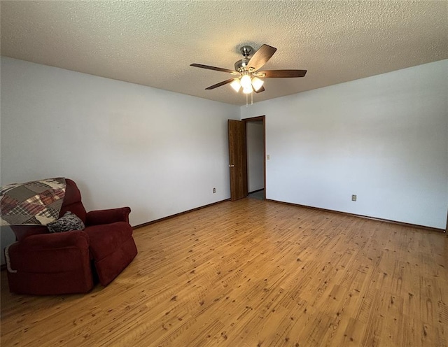 425 W Crooked Branch Way, Mustang, OK 73064 - unfurnished room featuring light wood-type flooring, ceiling fan, and a textured ceiling