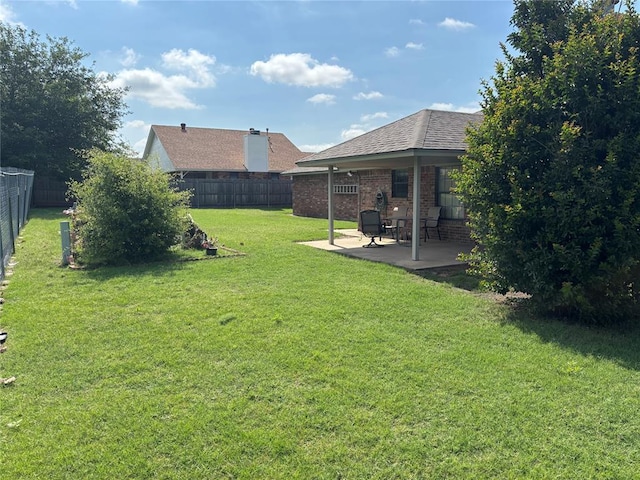 425 W Crooked Branch Way, Mustang, OK 73064 - fenced backyard featuring a patio area