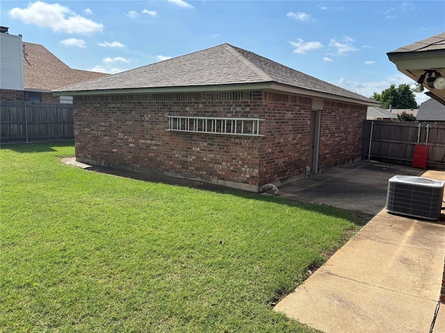 425 W Crooked Branch Way, Mustang, OK 73064 - view of side of property featuring brick siding, a fenced backyard, a patio area, and roof with shingles