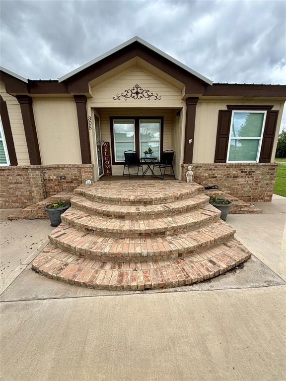 305 N Greer Ave, Duke, OK 73532 - entrance to property featuring a porch and brick siding