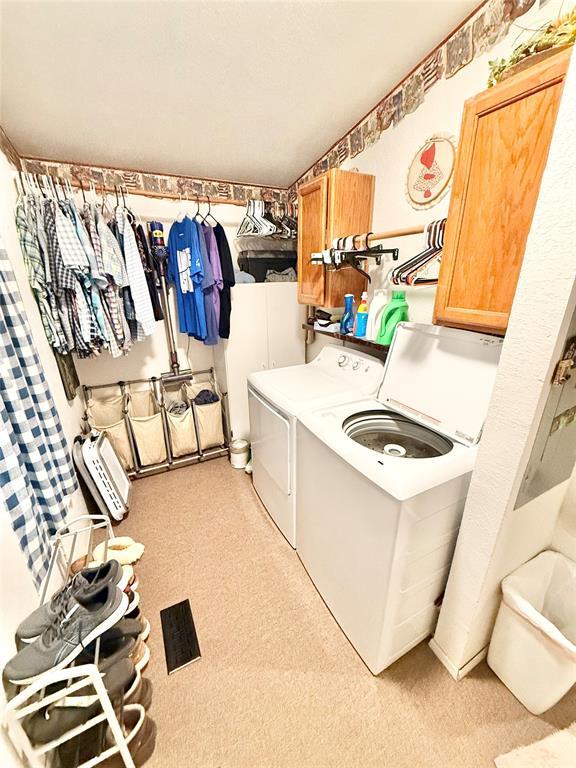 305 N Greer Ave, Duke, OK 73532 - laundry area with washing machine and clothes dryer and cabinet space