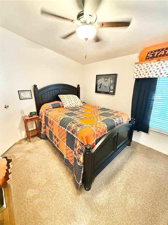 305 N Greer Ave, Duke, OK 73532 - carpeted bedroom featuring ceiling fan
