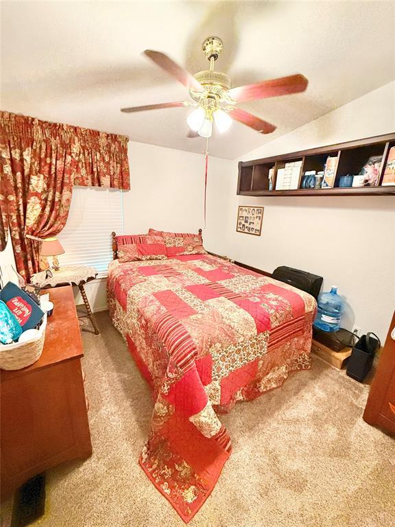 305 N Greer Ave, Duke, OK 73532 - carpeted bedroom with a ceiling fan