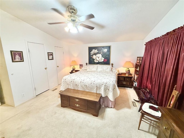 305 N Greer Ave, Duke, OK 73532 - bedroom featuring lofted ceiling, light colored carpet, and a ceiling fan