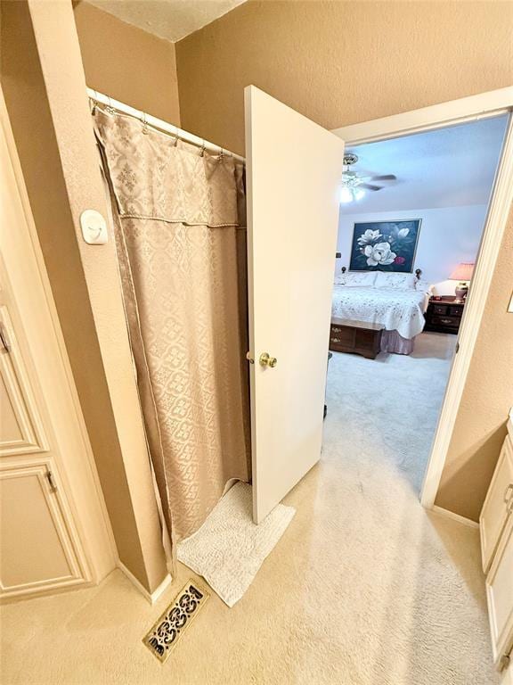 305 N Greer Ave, Duke, OK 73532 - ensuite bathroom featuring a shower with shower curtain and ceiling fan
