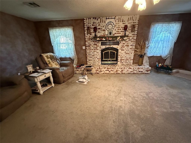 unfurnished living room with carpet flooring, a brick fireplace, and a textured ceiling