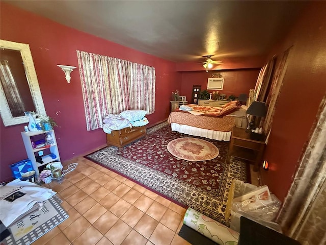 tiled bedroom with an AC wall unit and ceiling fan